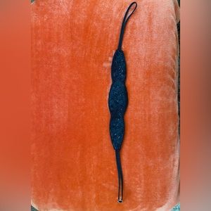 Black satin beaded belt in a size S/M.